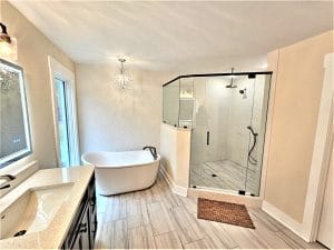 Contemporary Style Bath Design image by Guthrie Kitchen & Bath Plus Completed bathroom with freestanding tub and tiled walk-in shower by Guthrie Kitchen & Bath