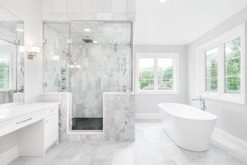 Should You Remove Your Last Bathtub for a Walk-In Shower? image by Guthrie Kitchen & Bath Plus A luxurious Middle Tennessee primary bathroom with a freestanding tub, white vanity, and a frameless glass walk-in shower with marble tile and a built-in bench — the hybrid layout that keeps a bathtub in the home while delivering the walk-in shower a homeowner actually uses daily.