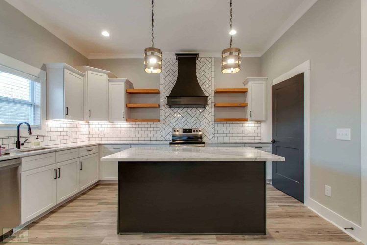 white kitchen cabinets and black island